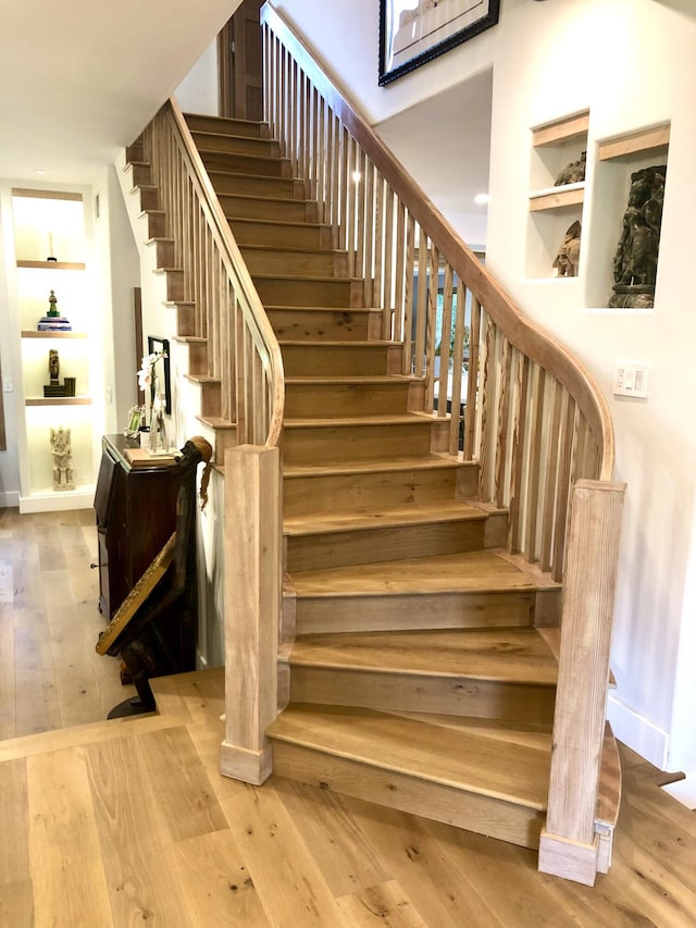 741 Saddle Ln, Ojai, CA 93023 - staircase featuring built in features, hardwood / wood-style floors, and baseboards