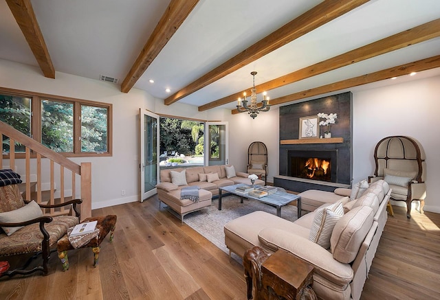 741 Saddle Ln, Ojai, CA 93023 - living room with baseboards, a chandelier, wood finished floors, beamed ceiling, and a fireplace