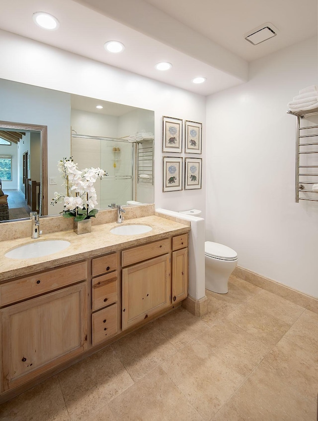 741 Saddle Ln, Ojai, CA 93023 - full bath with a shower stall, toilet, double vanity, recessed lighting, and baseboards