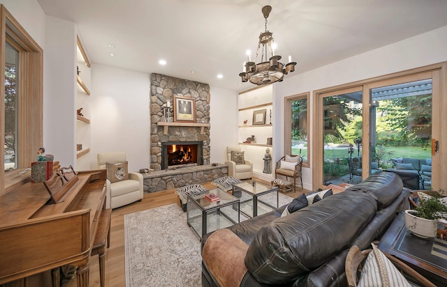 741 Saddle Ln, Ojai, CA 93023 - living area featuring wood finished floors, healthy amount of natural light, a chandelier, recessed lighting, and a fireplace