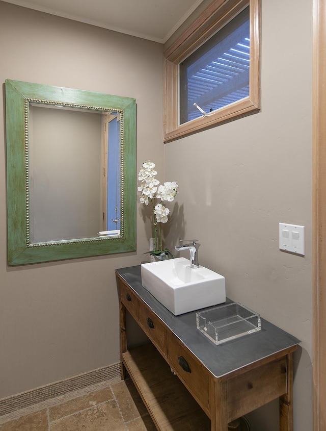 741 Saddle Ln, Ojai, CA 93023 - bathroom featuring vanity, stone finish flooring, and baseboards