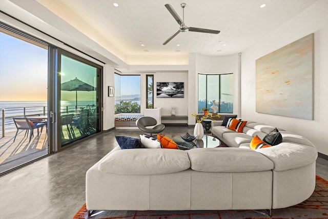 living area featuring ceiling fan, concrete flooring, and recessed lighting
