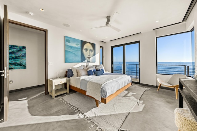 bedroom featuring ceiling fan, concrete floors, access to exterior, baseboards, and a water view