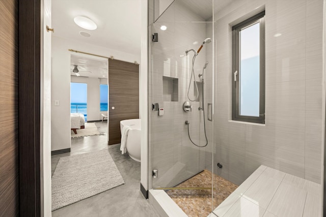 full bathroom with a water view, ensuite bathroom, and a shower stall