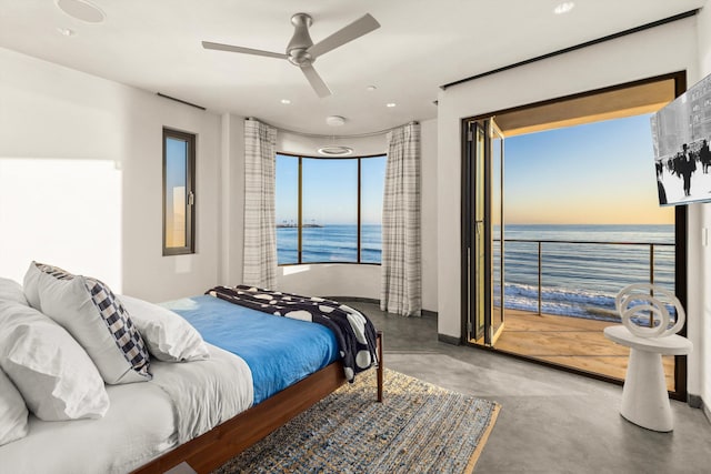 bedroom with recessed lighting, finished concrete flooring, a water view, and ceiling fan