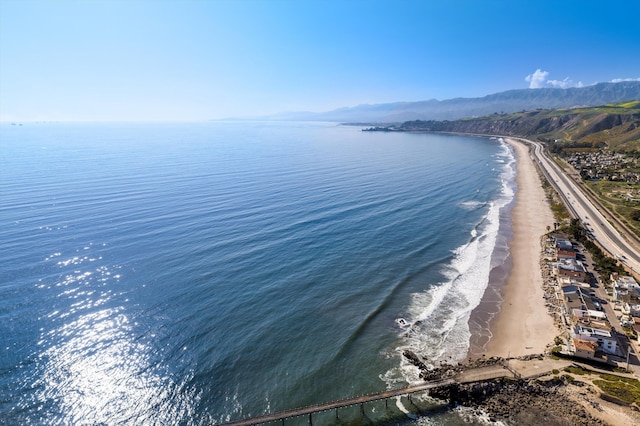 view of water feature featuring a beach view and a mountain view