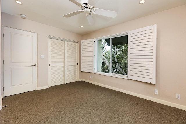 unfurnished bedroom featuring dark colored carpet, a closet, recessed lighting, and baseboards