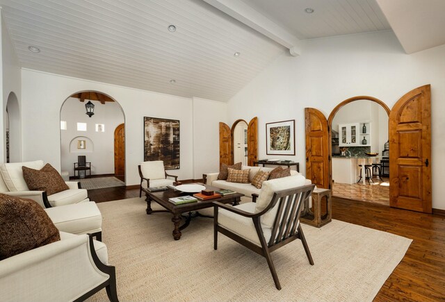 1060 Ladera Ln, Santa Barbara, CA 93108 - living room with dark wood-style flooring, beamed ceiling, high vaulted ceiling, and arched walkways