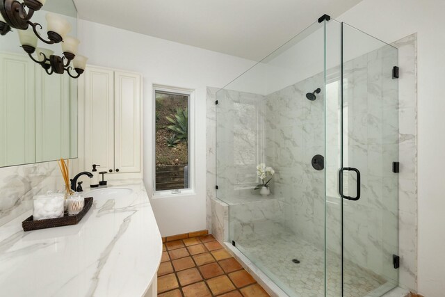 1060 Ladera Ln, Santa Barbara, CA 93108 - bathroom with a marble finish shower, tile patterned floors, vanity, and baseboards