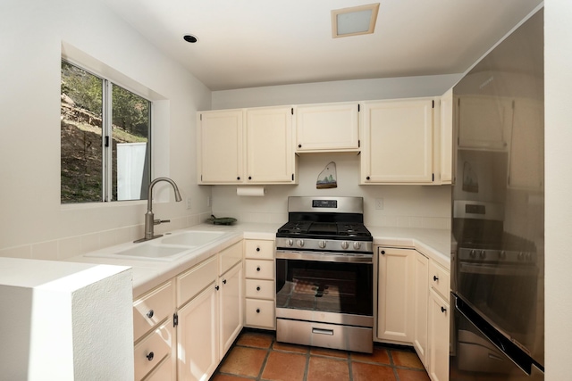 1060 Ladera Ln, Santa Barbara, CA 93108 - kitchen featuring light countertops, gas stove, a sink, and white cabinets