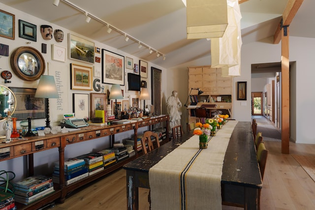 216 E Matilija St, Ojai, CA 93023 - dining space featuring rail lighting, hardwood / wood-style floors, and vaulted ceiling