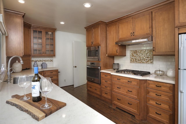 840 Mission Canyon Rd, Santa Barbara, CA 93105 - kitchen featuring stainless steel appliances, under cabinet range hood, light countertops, and brown cabinetry