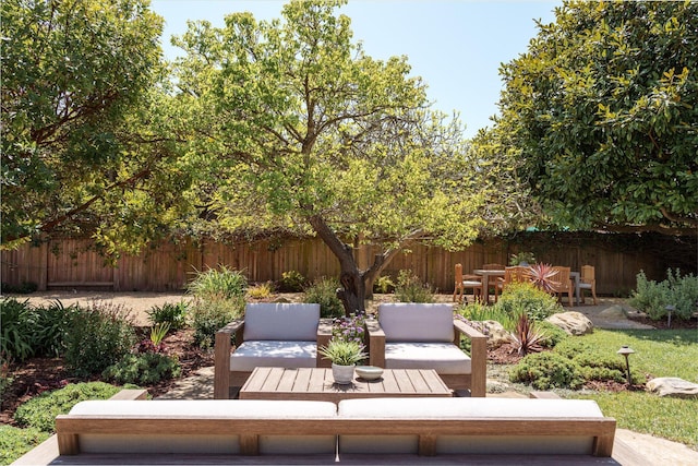 view of patio with an outdoor hangout area and fence