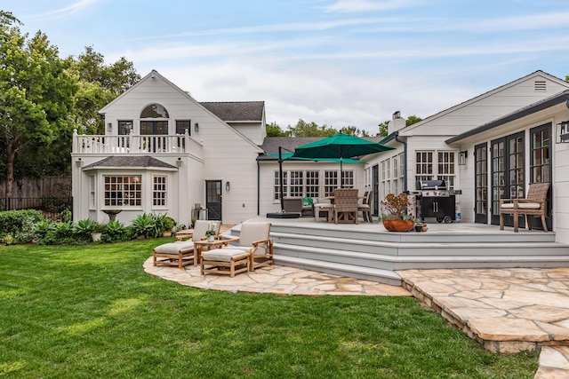 935 Arcady Rd, Santa Barbara, CA 93108 - back of property with outdoor lounge area, a lawn, roof with shingles, fence, and a balcony