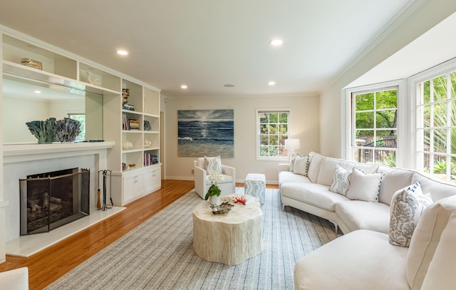 935 Arcady Rd, Santa Barbara, CA 93108 - living area featuring baseboards, ornamental molding, recessed lighting, a fireplace with raised hearth, and wood finished floors