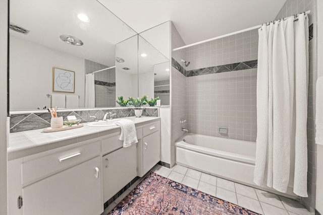 bathroom featuring shower / bath combo, vanity, and tile patterned flooring