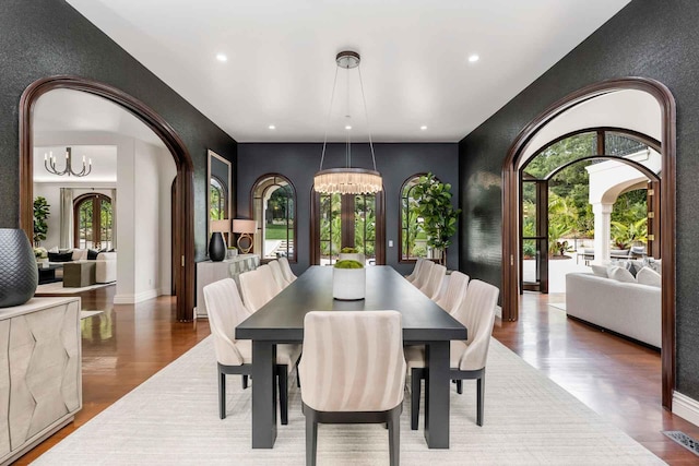 2084 E Valley Rd, Montecito, CA 93108 - dining space featuring recessed lighting, arched walkways, a notable chandelier, and wood finished floors