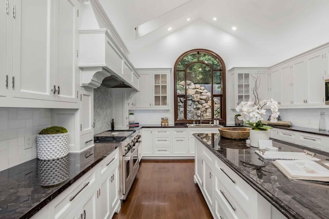 2084 E Valley Rd, Montecito, CA 93108 - kitchen featuring glass insert cabinets, white cabinets, double oven range, a sink, and backsplash