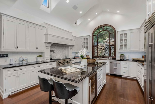 2084 E Valley Rd, Montecito, CA 93108 - kitchen with premium appliances, white cabinetry, and custom range hood