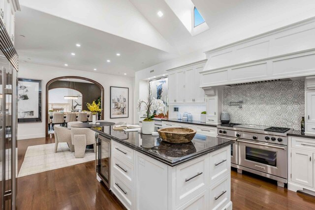 2084 E Valley Rd Unit 1, Santa Barbara, CA 93108 - kitchen with backsplash, luxury range, recessed lighting, and arched walkways
