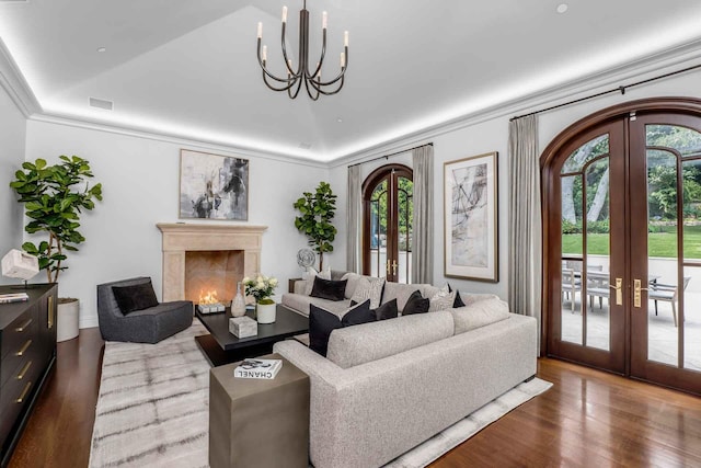 2084 E Valley Rd Unit 1, Santa Barbara, CA 93108 - living area with a chandelier, french doors, visible vents, and crown molding