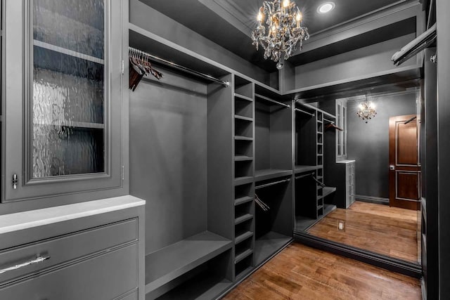 2084 E Valley Rd Unit 1, Santa Barbara, CA 93108 - spacious closet featuring an inviting chandelier and wood finished floors
