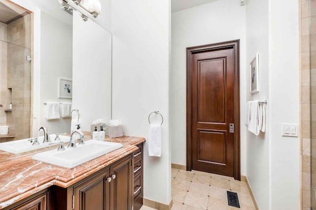 2084 E Valley Rd Unit 1, Santa Barbara, CA 93108 - full bathroom featuring a tile shower, visible vents, baseboards, and vanity