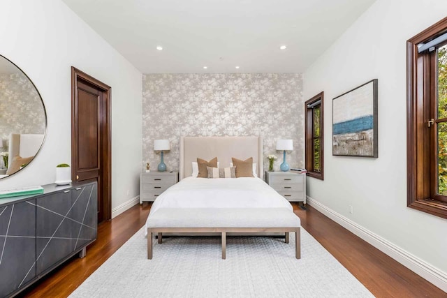 2084 E Valley Rd Unit 1, Santa Barbara, CA 93108 - bedroom featuring baseboards, an accent wall, dark wood finished floors, recessed lighting, and wallpapered walls