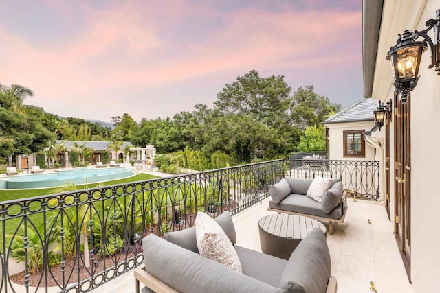 2084 E Valley Rd Unit 1, Santa Barbara, CA 93108 - balcony at dusk with an outdoor living space