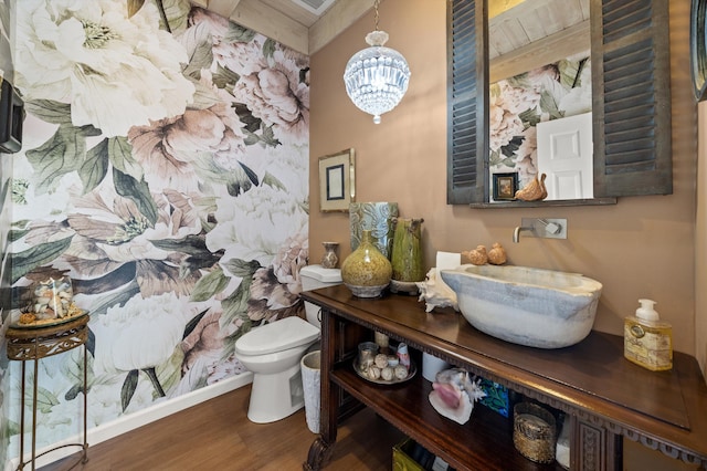 1435 Sycamore Canyon Rd, Santa Barbara, CA 93108 - bathroom featuring wood finished floors, toilet, a chandelier, baseboards, and vanity