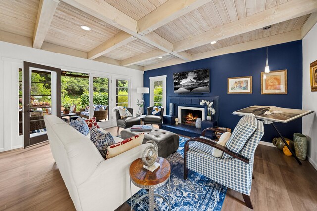 1435 Sycamore Canyon Rd, Santa Barbara, CA 93108 - living room with wood finished floors, wood ceiling, beam ceiling, a lit fireplace, and baseboards