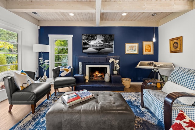 1435 Sycamore Canyon Rd, Santa Barbara, CA 93108 - living area featuring wood finished floors, wood ceiling, plenty of natural light, beam ceiling, and a lit fireplace