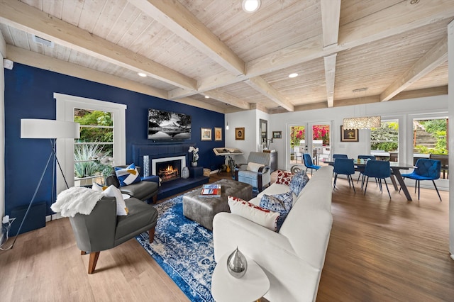 1435 Sycamore Canyon Rd, Santa Barbara, CA 93108 - living area featuring wood finished floors, beamed ceiling, a warm lit fireplace, wood ceiling, and recessed lighting