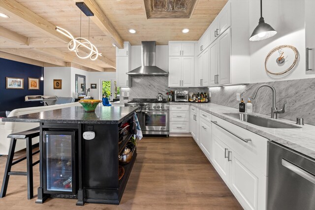 1435 Sycamore Canyon Rd, Santa Barbara, CA 93108 - kitchen with wall chimney exhaust hood, appliances with stainless steel finishes, wooden ceiling, a sink, and beverage cooler