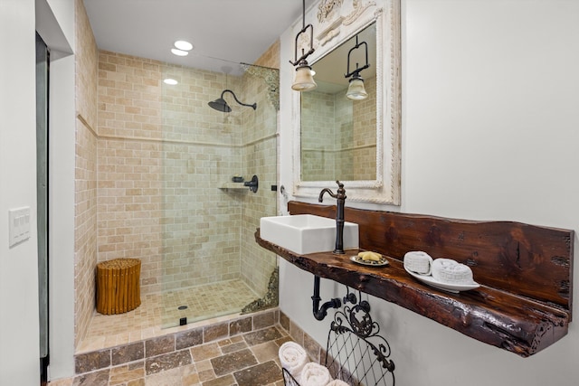 1435 Sycamore Canyon Rd, Santa Barbara, CA 93108 - bathroom featuring a sink, a shower stall, recessed lighting, and stone finish flooring