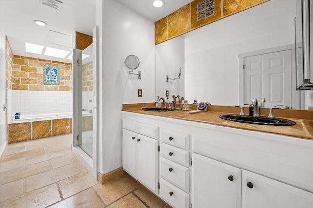 1435 Sycamore Canyon Rd, Santa Barbara, CA 93108 - full bath featuring stone tile flooring, a stall shower, double vanity, baseboards, and recessed lighting