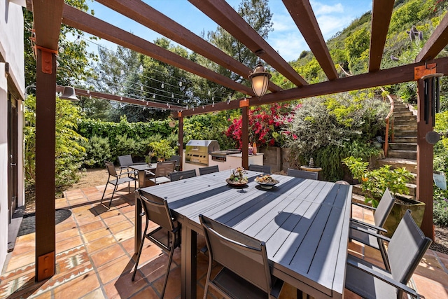 1435 Sycamore Canyon Rd, Santa Barbara, CA 93108 - view of patio featuring outdoor dining area, stairway, area for grilling, exterior kitchen, and a pergola