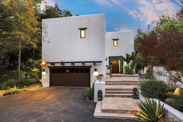 1435 Sycamore Canyon Rd, Santa Barbara, CA 93108 - view of front facade featuring a garage, stucco siding, and asphalt driveway