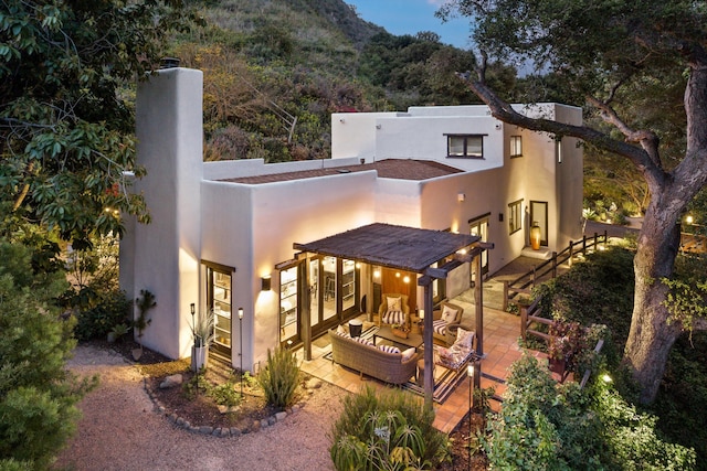 1435 Sycamore Canyon Rd, Santa Barbara, CA 93108 - rear view of house featuring an outdoor hangout area, french doors, a patio area, and stucco siding