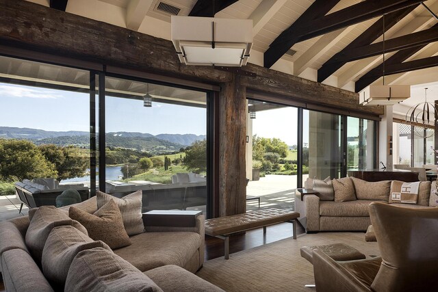 2794 Kara Ln, Solvang, CA 93463 - living room with high vaulted ceiling, plenty of natural light, visible vents, and beamed ceiling