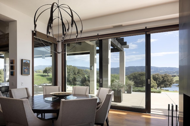 2794 Kara Ln, Solvang, CA 93463 - dining space with visible vents, wood finished floors, a mountain view, and an inviting chandelier