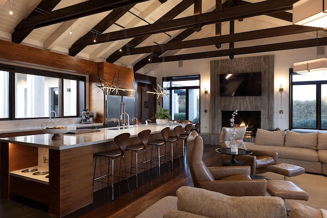 2794 Kara Ln, Solvang, CA 93463 - living room with dark wood-style floors, beamed ceiling, high vaulted ceiling, wood ceiling, and a premium fireplace