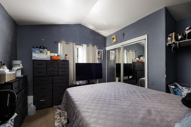carpeted bedroom with vaulted ceiling