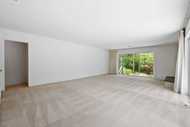 spare room featuring carpet