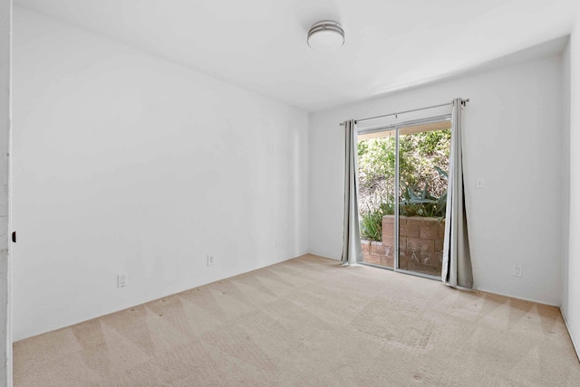 unfurnished room featuring carpet