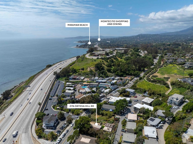 birds eye view of property with a residential view and a water view