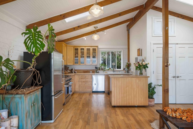 kitchen featuring glass insert cabinets, light brown cabinetry, stainless steel appliances, beamed ceiling, and light wood finished floors