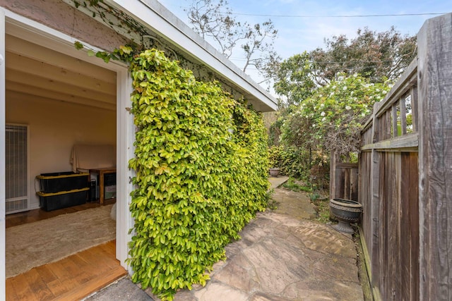 view of side of home with a patio area