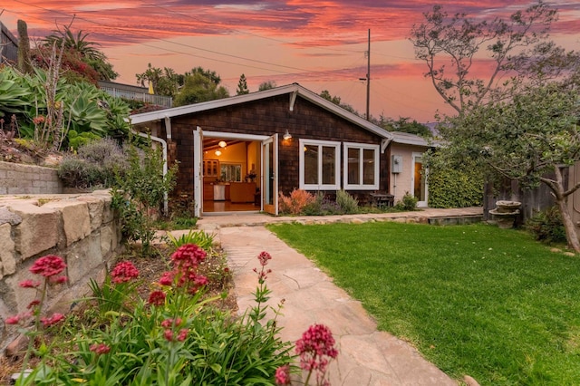 back of house with a yard
