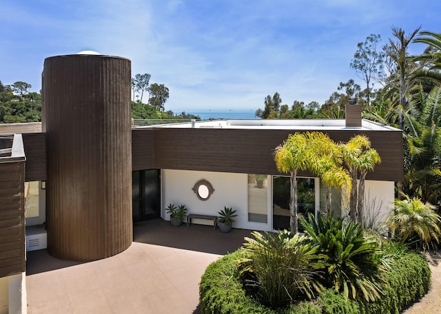 1776 Eucalyptus Hill Rd, Santa Barbara, CA 93103 - view of front of home with a chimney and a water view